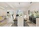 Elegant dining room featuring a modern light fixture, stylish decor, and a seamless flow into the kitchen at 2163 Plantation Oak Dr, Orlando, FL 32824