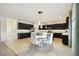 Bright kitchen area with dark wood cabinets, a light countertop island and stainless appliances at 2163 Plantation Oak Dr, Orlando, FL 32824