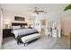 Well-lit main bedroom showcasing a king bed and ensuite bathroom, providing a comfortable and private space at 2163 Plantation Oak Dr, Orlando, FL 32824