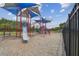 Colorful community playground with a slide, climbing structures, and safety surface at 2163 Plantation Oak Dr, Orlando, FL 32824