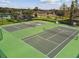 Aerial shot of well-maintained tennis courts offering a great space for active recreation at 2163 Plantation Oak Dr, Orlando, FL 32824