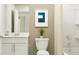 Well-lit bathroom features a shower/tub combo and a stylish single sink vanity at 2724 Pioneer Trl, Eagle Lake, FL 33839