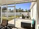 View of patio area and backyard with seating and privacy fence at 2987 Neverland Dr, New Smyrna Beach, FL 32168