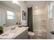 Well-lit bathroom with vanity, framed mirror, decorative bath mat, and a shower-tub combination at 3146 Skyline Loop, Kissimmee, FL 34758