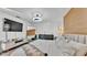 Bedroom featuring modern furniture, lighting, and a large mirror at 5152 Belmont Park Way, Mulberry, FL 33860