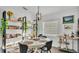 Bright dining area with shelving, stylish lighting, and a view of the kitchen at 5152 Belmont Park Way, Mulberry, FL 33860