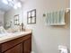 Well-lit bathroom featuring a decorative wall and accessories at 6455 Sedgeford Dr, Lakeland, FL 33811