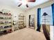 Bedroom featuring a vanity and a display of shoes and storage at 6455 Sedgeford Dr, Lakeland, FL 33811