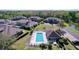 Community pool featuring ample seating and a spacious deck for relaxing at 6455 Sedgeford Dr, Lakeland, FL 33811