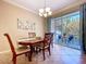 Dining room with sliding glass doors that lead to an outdoor patio, natural light, and tile flooring at 6455 Sedgeford Dr, Lakeland, FL 33811