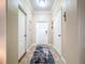 Inviting foyer with a stylish blue rug, neutral walls, and a tray ceiling with recessed lighting at 6455 Sedgeford Dr, Lakeland, FL 33811