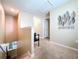 Hallway landing featuring a bench and an art wall at 6455 Sedgeford Dr, Lakeland, FL 33811