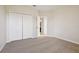 Neutral bedroom with closet and door to other rooms at 9147 Shepton St, Orlando, FL 32825