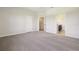 Spacious carpeted bedroom with closet and bathroom entrance at 9147 Shepton St, Orlando, FL 32825