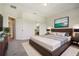 Stylishly furnished main bedroom featuring a plush bed and modern decor at 9147 Shepton St, Orlando, FL 32825