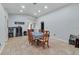 Bright dining area featuring tiled floors, ample space, and a large dining table at 114 Briarcliff Dr, Kissimmee, FL 34758