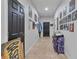 Hallway with tiled floors, decorated walls, and recessed lighting leading to other rooms at 114 Briarcliff Dr, Kissimmee, FL 34758