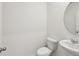 Half bathroom featuring a modern sink and toilet at 2122 Rosewood Dr, Bartow, FL 33830