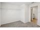 Bedroom leading to closet with shelving and bathroom with tiled floors and granite vanity at 2122 Rosewood Dr, Bartow, FL 33830