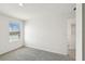 Neutral bedroom features a bright window and carpet at 2122 Rosewood Dr, Bartow, FL 33830