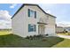 Two story home with a lush green lawn featuring an attached garage and well-maintained landscaping at 2122 Rosewood Dr, Bartow, FL 33830