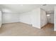 A bright and airy living room with wood-look tile floors showcasing a staircase and neutral paint at 2122 Rosewood Dr, Bartow, FL 33830