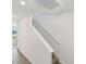 Staircase with white walls and view to the outside at 2122 Rosewood Dr, Bartow, FL 33830