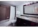 Well-lit bathroom with a vanity featuring a granite countertop, mirror, and a shower-tub combination at 6337 Parc Corniche Dr # 2101, Orlando, FL 32821