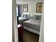 Cozy bedroom featuring two beds with stylish gray bedding and framed artwork on the walls at 6337 Parc Corniche Dr # 2101, Orlando, FL 32821