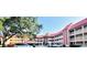 Condominium complex boasts red tile roofs, multiple stories, covered balconies, and ample parking space at 6337 Parc Corniche Dr # 2101, Orlando, FL 32821