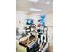 Well-equipped gym with treadmills, exercise bikes, stability balls, and a TV for entertainment during workouts at 6337 Parc Corniche Dr # 2101, Orlando, FL 32821