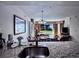 Granite kitchen counter overlooking dining area with water view picture; chandelier over dining table at 6337 Parc Corniche Dr # 2101, Orlando, FL 32821