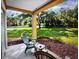 Relaxing outdoor patio with comfortable seating and a serene view of the landscaped yard at 6337 Parc Corniche Dr # 2101, Orlando, FL 32821