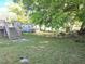Backyard with shed, deck and stairway surrounded by greenery at 663 Hager St, Deltona, FL 32725