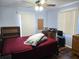 Bedroom with a ceiling fan, and wood floors at 663 Hager St, Deltona, FL 32725