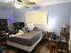 Bedroom features a ceiling fan and natural light at 663 Hager St, Deltona, FL 32725