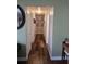 Hallway featuring hardwood floors, neutral paint, and decorative frames at 663 Hager St, Deltona, FL 32725
