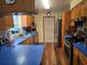 Functional kitchen featuring wood cabinets, stainless steel appliances, and blue countertops at 663 Hager St, Deltona, FL 32725