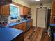 Functional kitchen featuring wood cabinets, stainless steel appliances, and blue countertops at 663 Hager St, Deltona, FL 32725