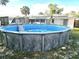 Backyard features an above ground pool and solar panels on the roof at 663 Hager St, Deltona, FL 32725