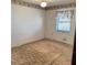 Bedroom featuring carpeted floors, a window, and decorated wallpaper at 102 Center Sw St, Winter Haven, FL 33880