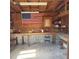 Unfinished garage features an American flag, work bench, and concrete floor at 102 Center Sw St, Winter Haven, FL 33880
