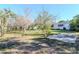 This spacious backyard includes mature trees and a concrete patio offering great outdoor living at 211 W Valencia St, Lakeland, FL 33805