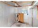 Unfinished basement showcasing the utilities, framing, and potential for customization at 211 W Valencia St, Lakeland, FL 33805