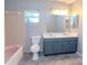 Modest bathroom featuring a double sink vanity and a bathtub, perfect for a functional space at 211 W Valencia St, Lakeland, FL 33805
