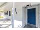 View of Front Door with a covered walkway at 211 W Valencia St, Lakeland, FL 33805