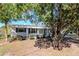 Inviting single-story home featuring mature trees and lush front yard at 211 W Valencia St, Lakeland, FL 33805