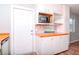Bright kitchen with white cabinets and ample storage space at 211 W Valencia St, Lakeland, FL 33805