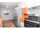 Cozy kitchen features stainless steel appliances and hardwood floors at 211 W Valencia St, Lakeland, FL 33805