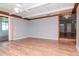 Inviting living room featuring hardwood floors and sliding glass doors at 211 W Valencia St, Lakeland, FL 33805